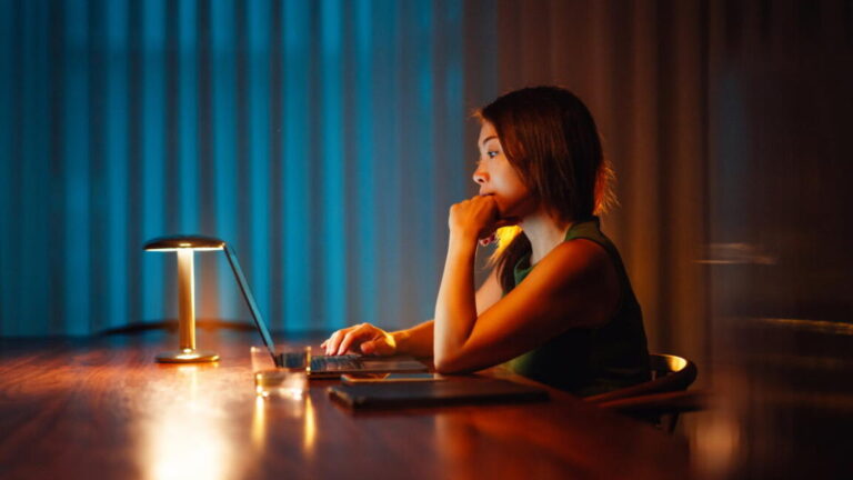 AI chatbots have failed people in crisis. Can that be fixed? A woman using a laptop at night