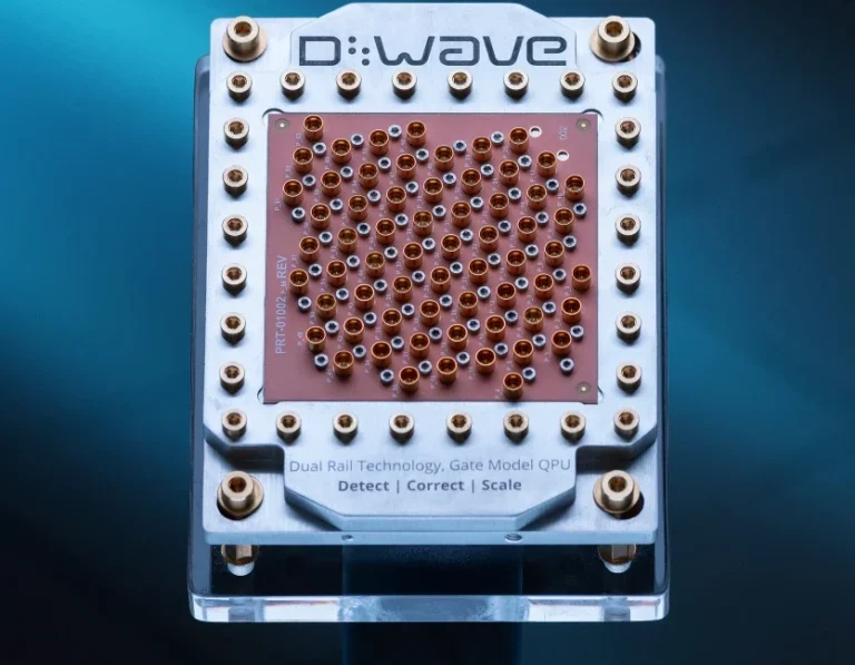 D-Wave shows off its new entry in quantum computing race Image of a silvery metallic case surrounding a brown-orange piece of plastic with multiple holes in it.