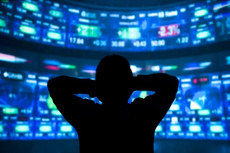 Embattled hedge fund Situational Awareness invests $400M in chip startup Source Foundry young man standing in front of the projection reflected stock market