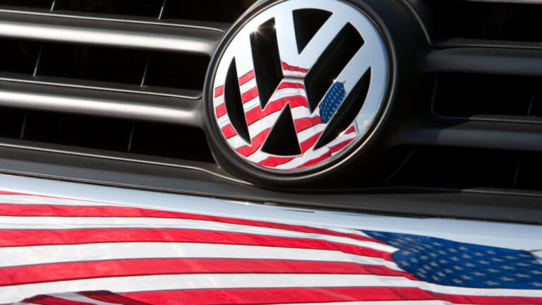 Volkswagen plans to win America back with a pickup, report says FILE - An archive picture of a US-flag that is being reflected in a Volkswagen car front in Chattanooga, US, 15 May 2009. Photo: Friso Gentsch/dpa (Photo by Friso Gentsch/picture alliance via Getty Images)