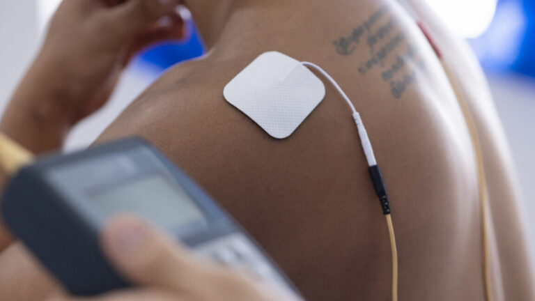 A local network of implants uses your body as the wiring Image of an electrode stuck to a man's shoulder.
