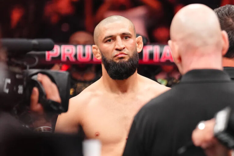 Khazmat Chimaev stares across from Sean Strickland moments before their UFC 328 fight
